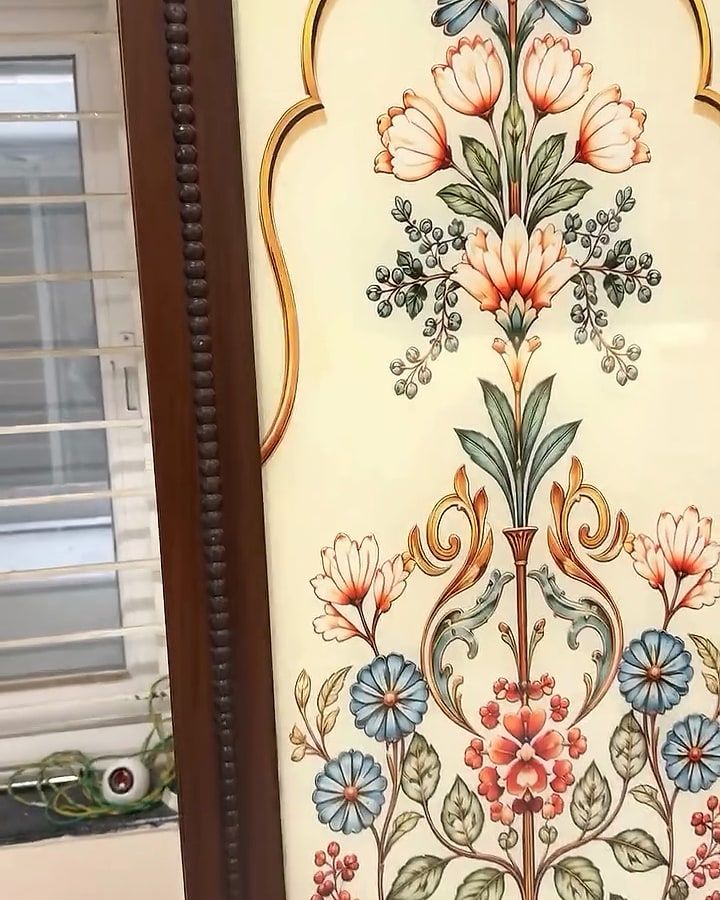 Floral art panel under a cusped arch, set in a walnut-finish wardrobe