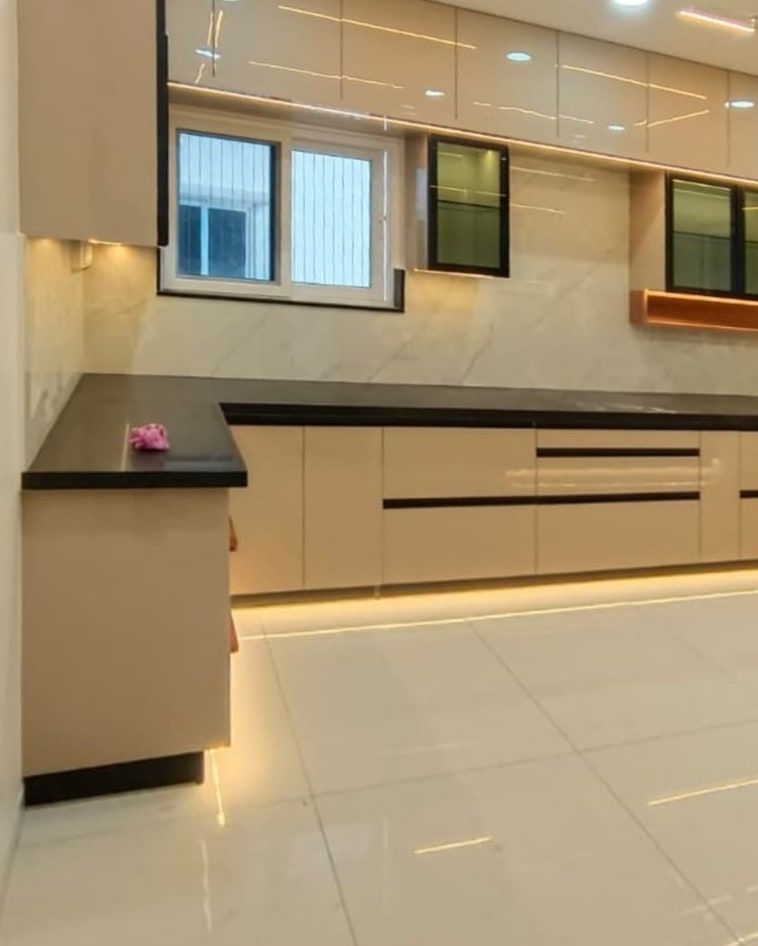 Champagne kitchen with glass uppers and a lit plinth