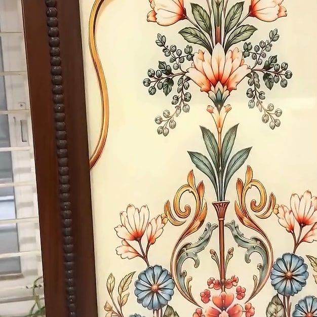 Floral art panel on a wardrobe shutter, framed in a cusped arch
