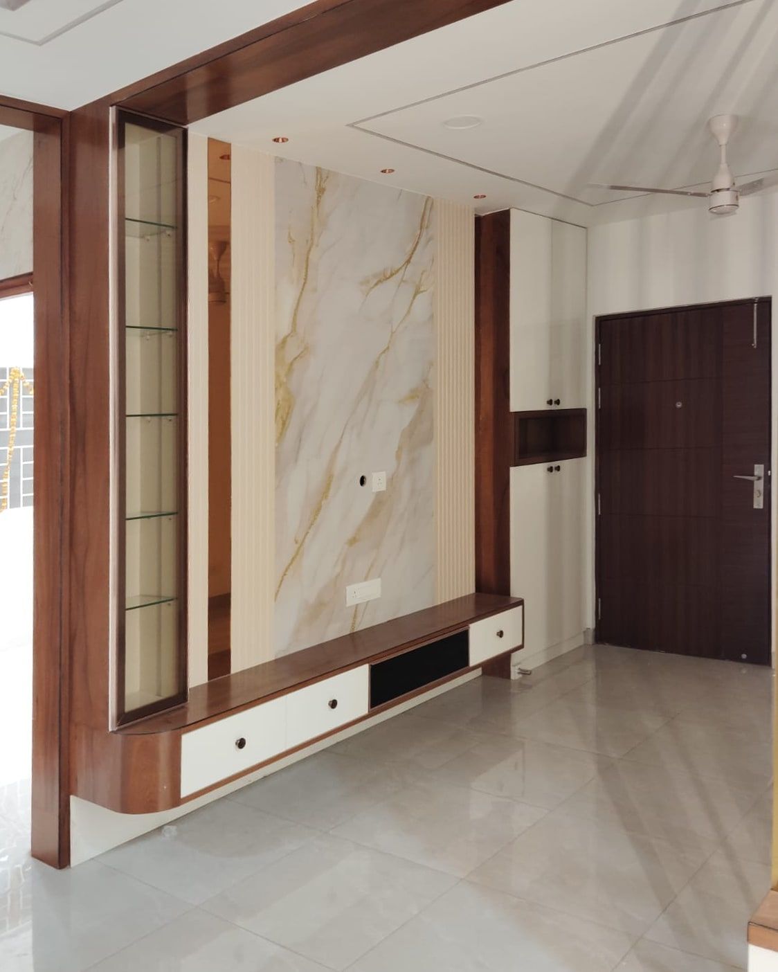 Wood-finish portal curving into a floating console under a marble-look panel